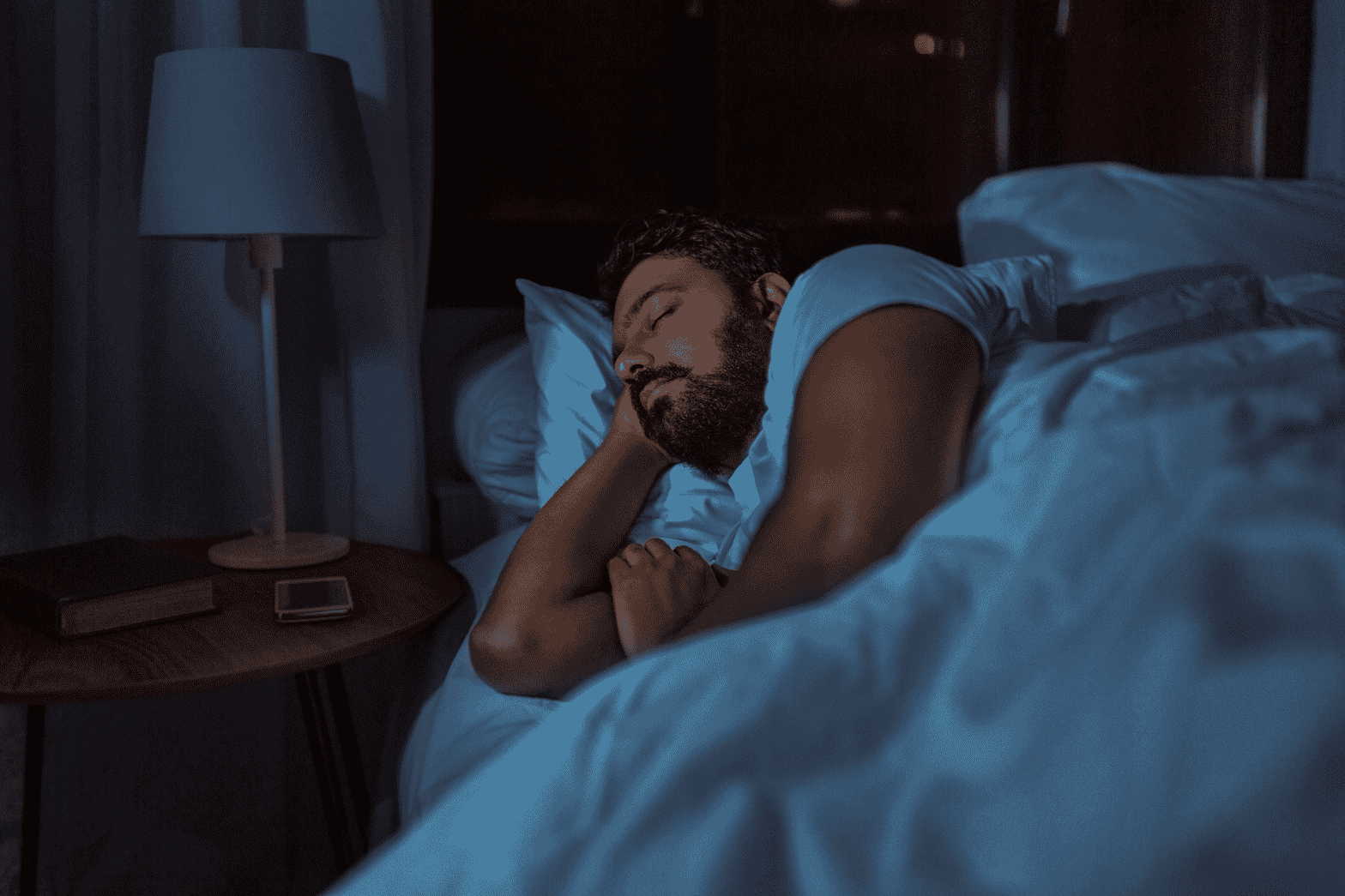 Man sleeping in bed